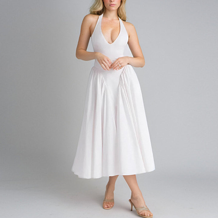 Kvinnors Elegant Maxi Klänning med Djup V-Hals och Flödande Kjol Mirla-Eva Jonsson