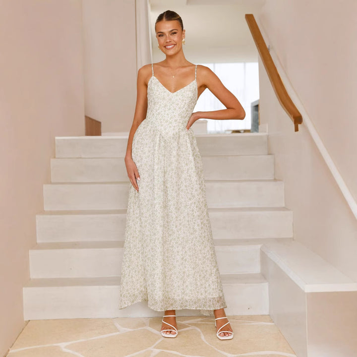 Kvinnors Elegant Maxi Klänning med Fint Blommönster och Delikata Spaghettistroppar Mirla-Eva Jonsson