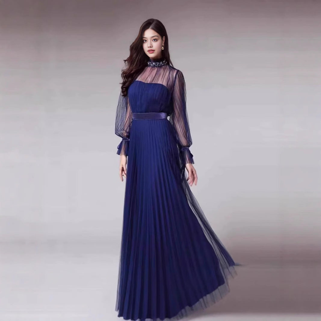 Kvinnors Elegant Maxi Klänning med Glittrande Chiffon och Lekfulla Volang Detaljer-Eva Jonsson