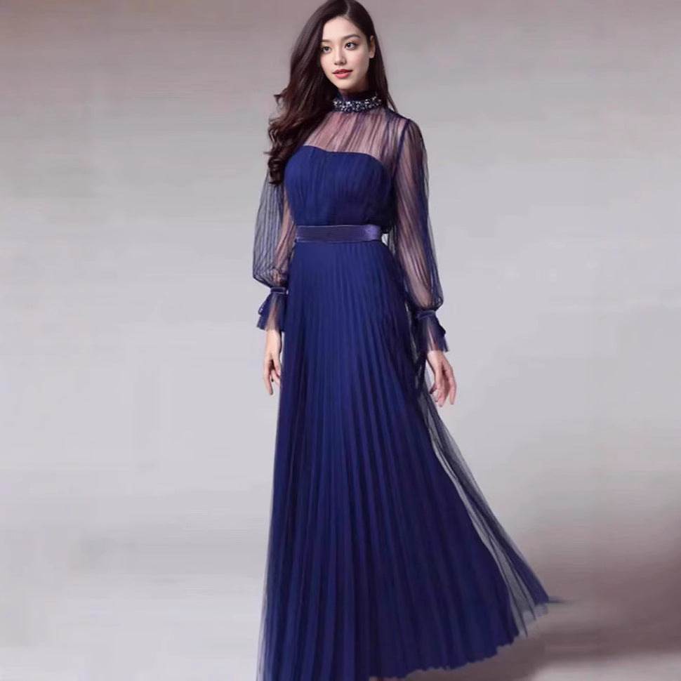 Kvinnors Elegant Maxi Klänning med Glittrande Chiffon och Lekfulla Volang Detaljer-Eva Jonsson
