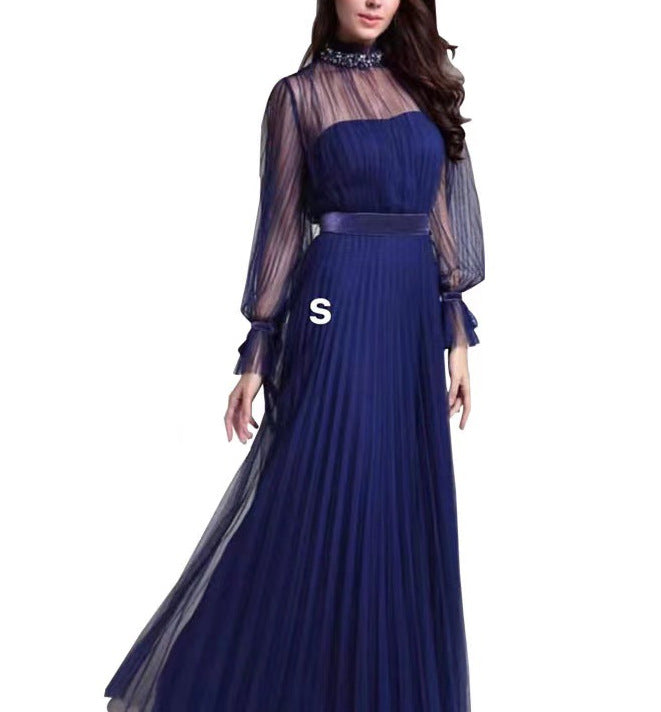 Kvinnors Elegant Maxi Klänning med Glittrande Chiffon och Lekfulla Volang Detaljer-Eva Jonsson
