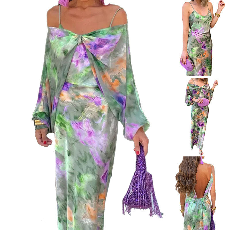 Kvinnors Elegant Maxi Klänning med Lekfull Skärning och Transparenta Ärmar Mirla-Eva Jonsson