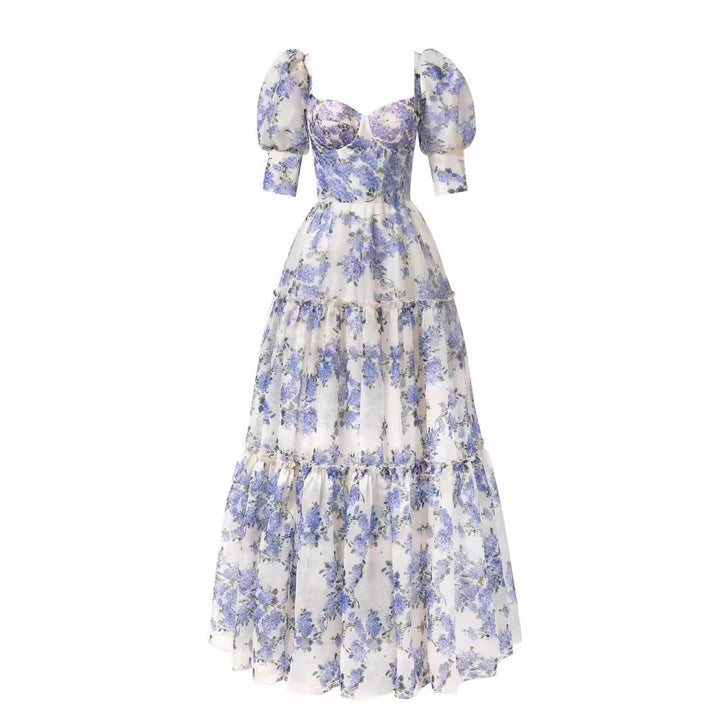 Kvinnors Elegant Maxi Klänning med Off-the-Shoulder Volangärmar och Blommiga Accenter-Eva Jonsson