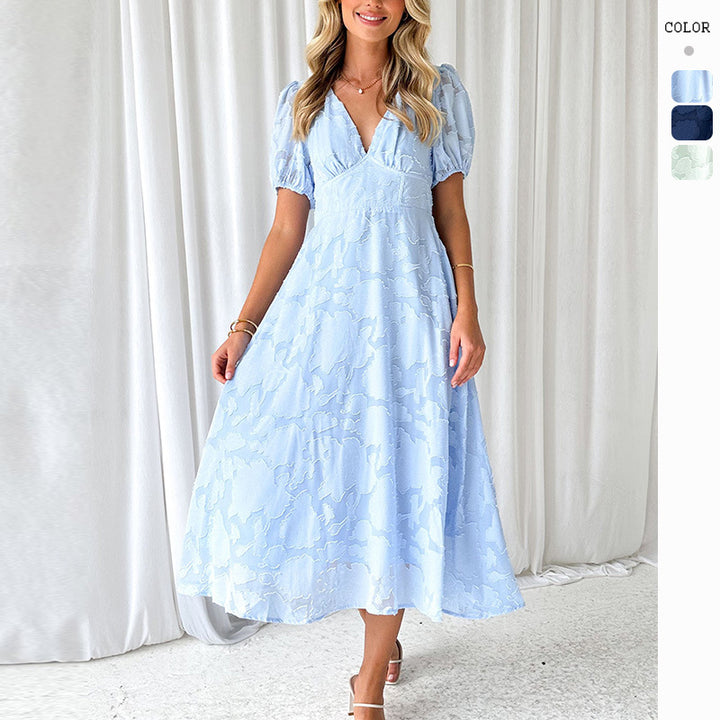 Kvinnors Elegant Maxi Klänning med Rynkade Ärmar och Blommig Struktur Mirla-Eva Jonsson