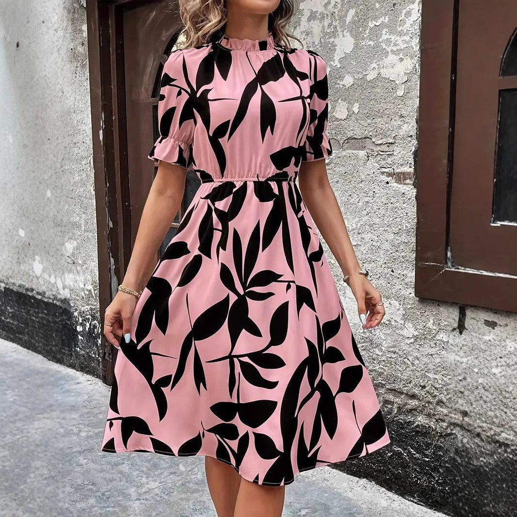 Kvinnors Elegant Midi Klänning med Stilig Växtmönster och Elastisk Midja Mirla-Eva Jonsson