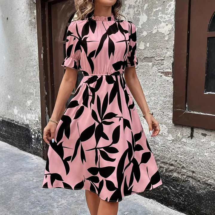 Kvinnors Elegant Midi Klänning med Stilig Växtmönster och Elastisk Midja Mirla-Eva Jonsson