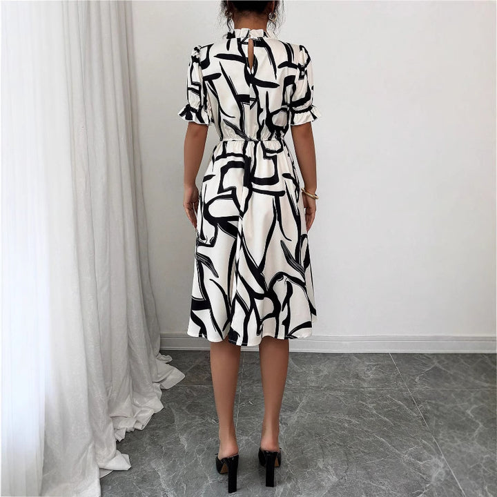 Kvinnors Elegant Midi Klänning med Stilig Växtmönster och Elastisk Midja Mirla-Eva Jonsson