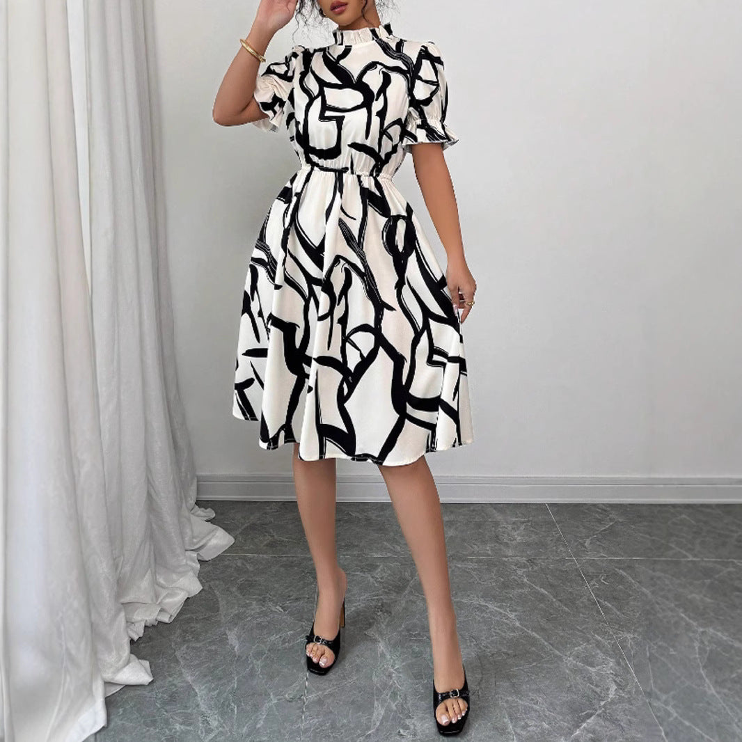 Kvinnors Elegant Midi Klänning med Stilig Växtmönster och Elastisk Midja Mirla-Eva Jonsson