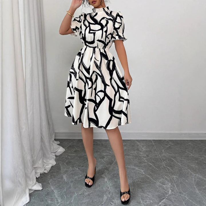Kvinnors Elegant Midi Klänning med Stilig Växtmönster och Elastisk Midja Mirla-Eva Jonsson