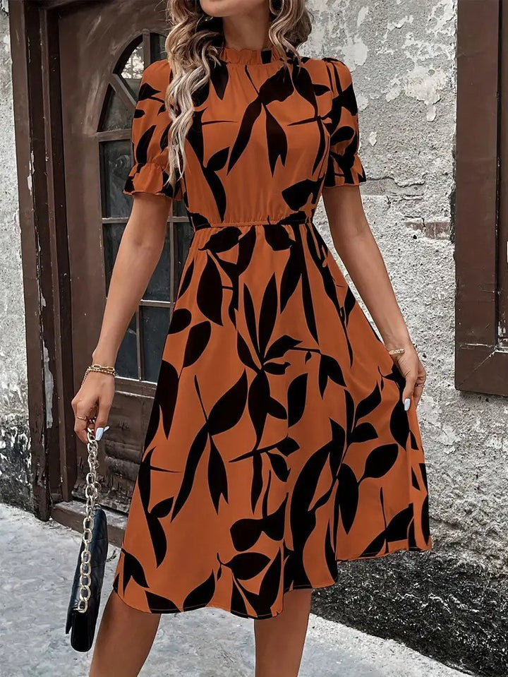 Kvinnors Elegant Midi Klänning med Stilig Växtmönster och Elastisk Midja Mirla-Eva Jonsson