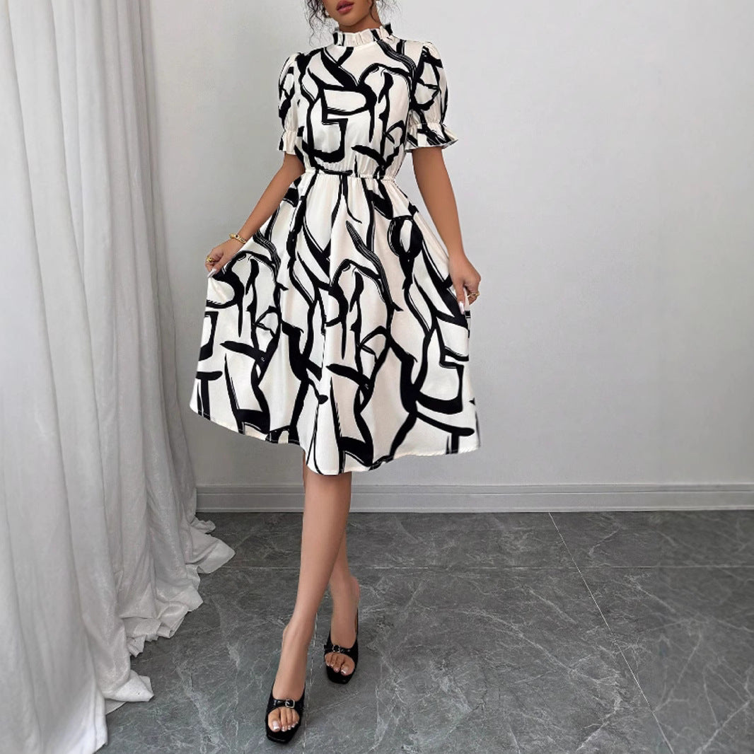 Kvinnors Elegant Midi Klänning med Stilig Växtmönster och Elastisk Midja Mirla-Eva Jonsson