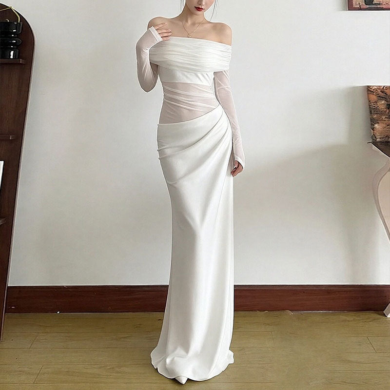 Kvinnors Elegant Off-Shoulder Maxi Klänning med Volangdetaljer och Lång Ärmel Mirla-Eva Jonsson