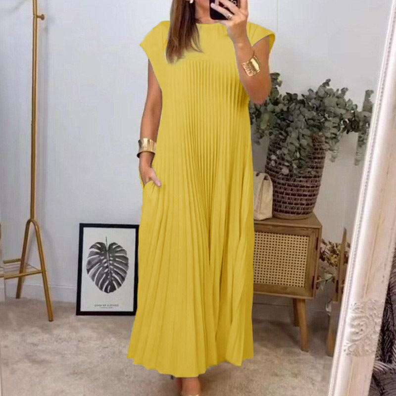 Kvinnors Elegant Plisserad Maxi Klänning med Praktiska Fickor Mirla-Eva Jonsson