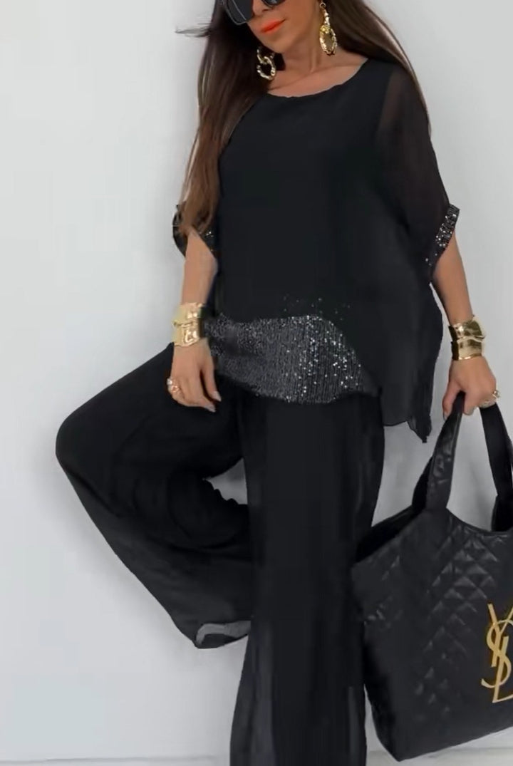 Kvinnors Elegant Tvådelad Byxdress med Glittrande Topp Mirla-Eva Jonsson