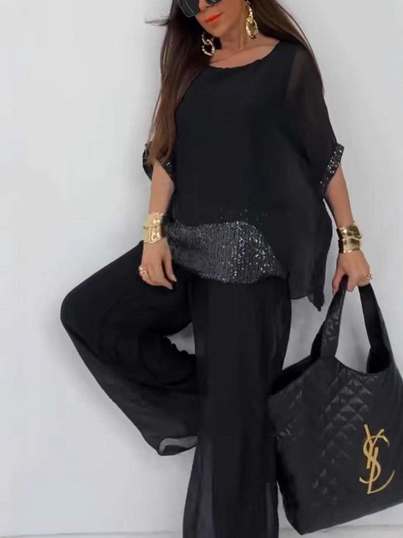 Kvinnors Elegant Tvådelad Byxdress med Glittrande Topp Mirla-Eva Jonsson
