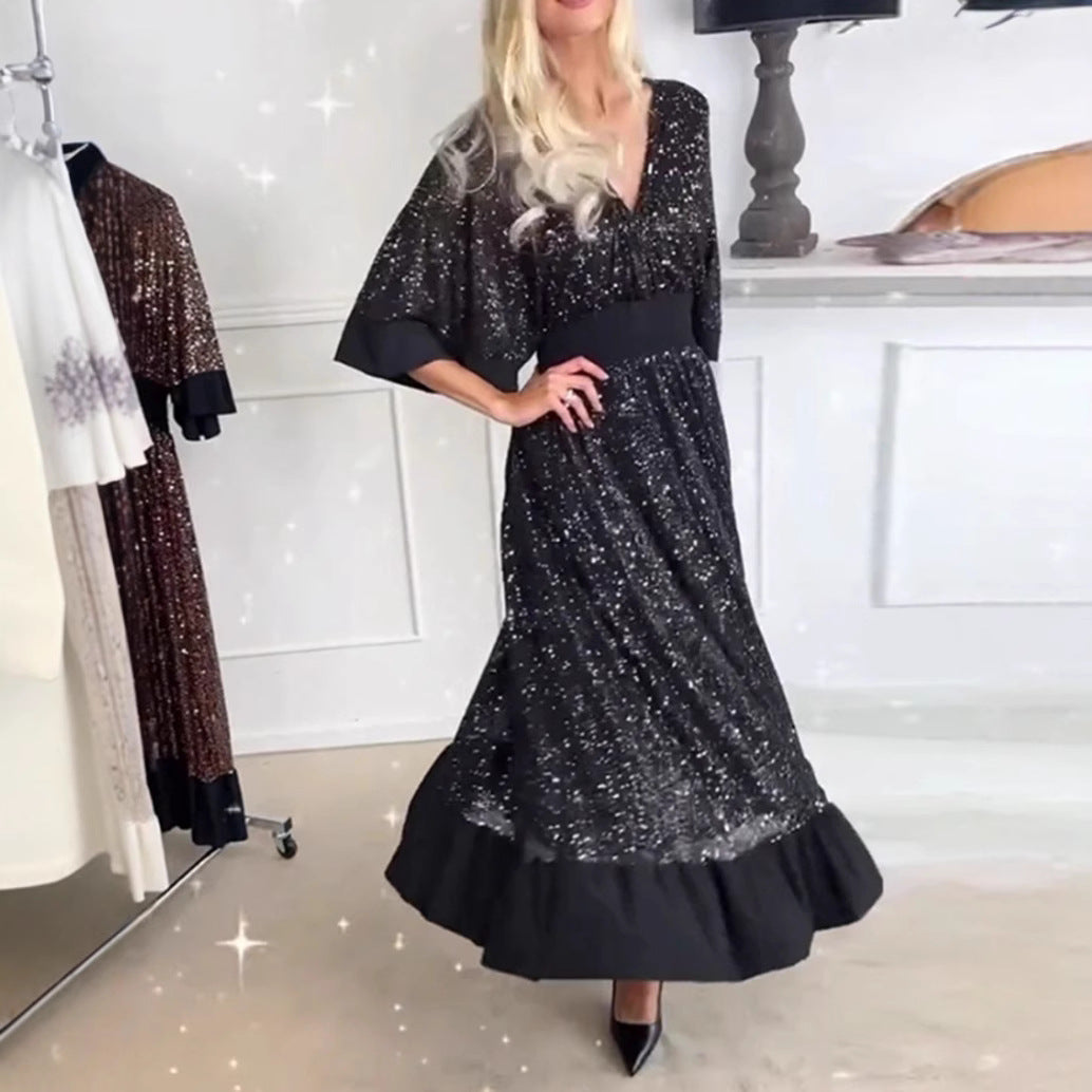 Kvinnors Glamorous Kvällsklänning med Glittrande Accenter och Voluminösa Ärmar Mirla-Eva Jonsson