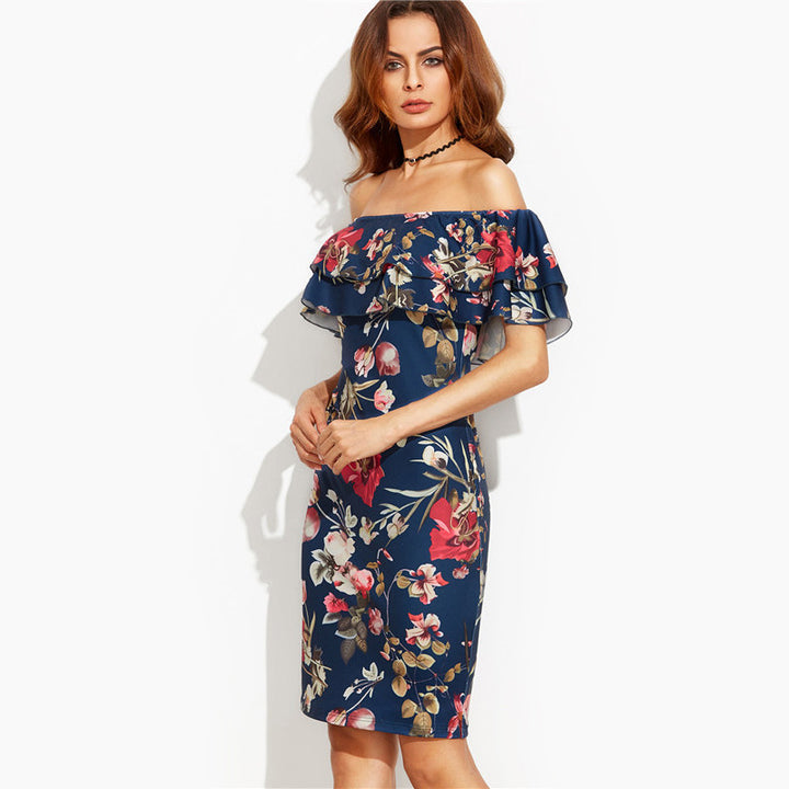 Kvinnors Off-Shoulder Blommig Klänning med Voluminösa Ruffle Detaljer och Figurformande Snitt Mirla-Eva Jonsson