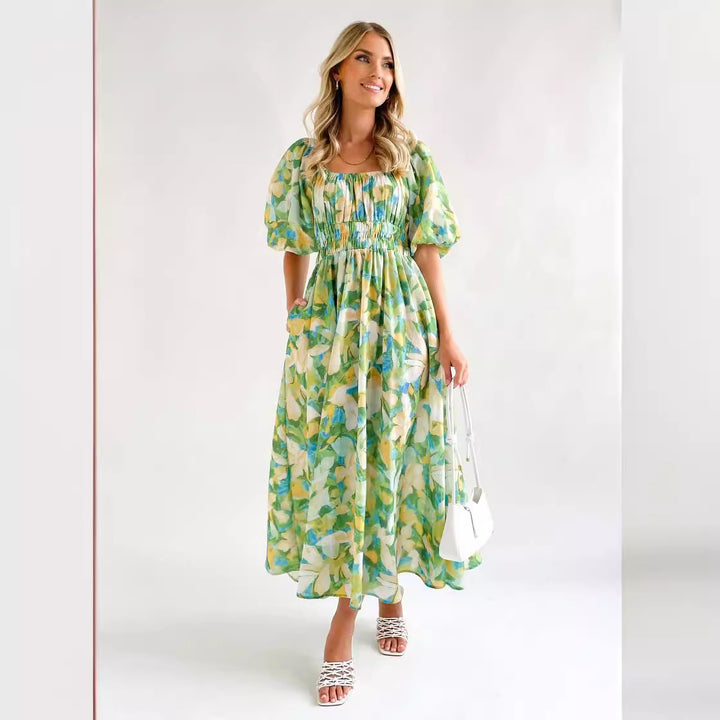Kvinnors Off-Shoulder Maxi Klänning med Blommönster och Elastisk Midja Mirla-Eva Jonsson