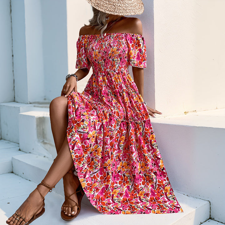 Kvinnors Off-Shoulder Maxi Klänning med Blommönster och Volangdetaljer Mirla-Eva Jonsson