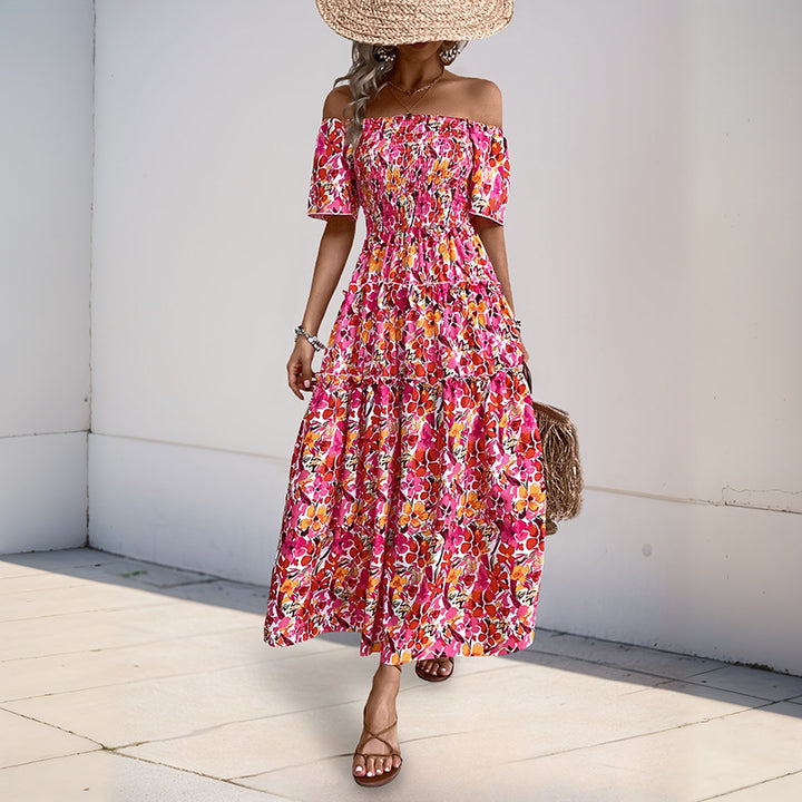 Kvinnors Off-Shoulder Maxi Klänning med Blommönster och Volangdetaljer Mirla-Eva Jonsson