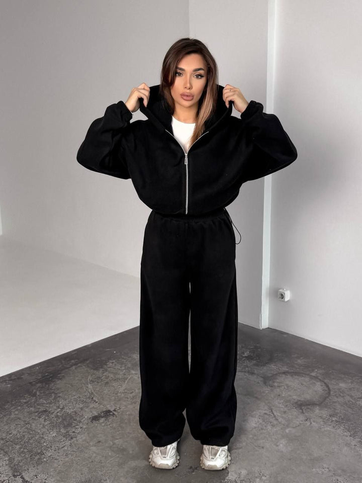 Kvinnors Oversized Fleece Träningsoverall med Huva och Vida Ben Mirla-Eva Jonsson