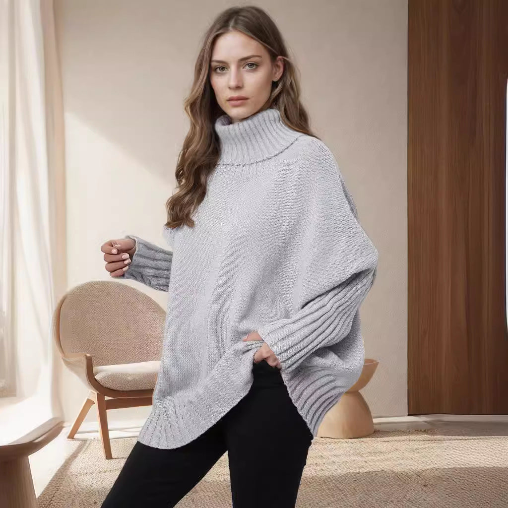 Kvinnors Oversized Stickad Tröja med Hög Krage och Voluminösa Ärmar Mirla-Eva Jonsson