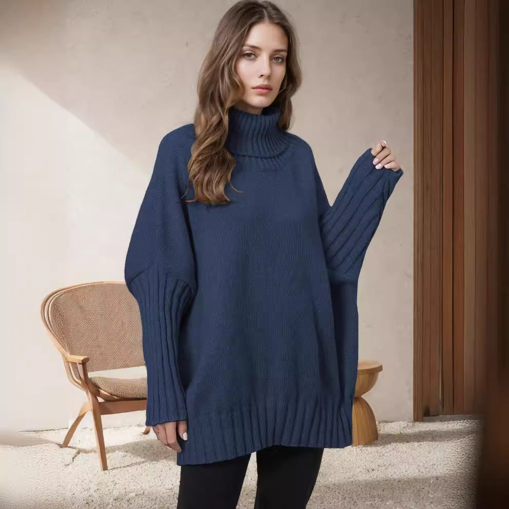 Kvinnors Oversized Stickad Tröja med Hög Krage och Voluminösa Ärmar Mirla-Eva Jonsson