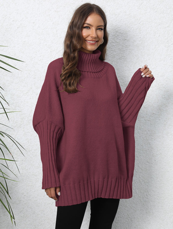 Kvinnors Oversized Stickad Tröja med Hög Krage och Voluminösa Ärmar Mirla-Eva Jonsson