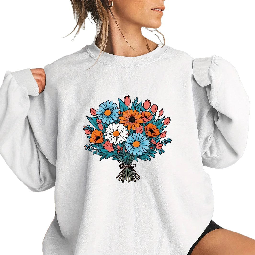 Kvinnors Oversized Sweatshirt med Blommiga Grafikdetaljer Mirla-Eva Jonsson