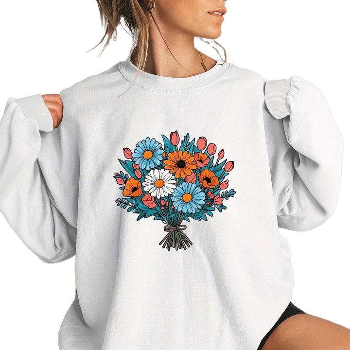 Kvinnors Oversized Sweatshirt med Blommiga Grafikdetaljer Mirla-Eva Jonsson