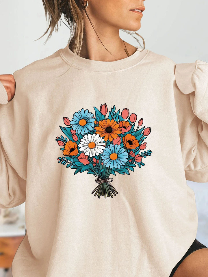 Kvinnors Oversized Sweatshirt med Blommiga Grafikdetaljer Mirla-Eva Jonsson