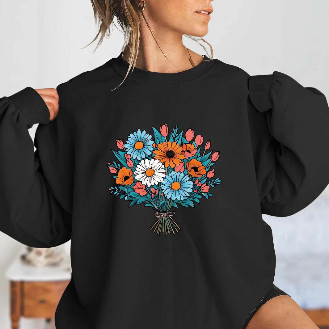 Kvinnors Oversized Sweatshirt med Blommiga Grafikdetaljer Mirla-Eva Jonsson