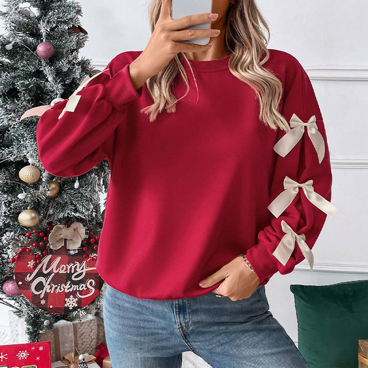 Kvinnors Oversized Tröja med Lekfulla Klänkningsdetaljer Mirla-Eva Jonsson