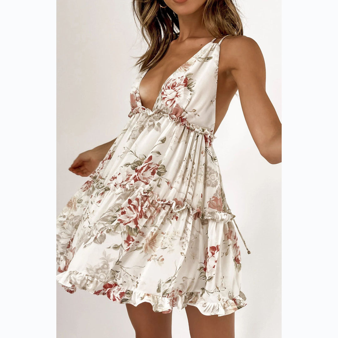 Kvinnors Strålande Sommardress med Flödande Snitt och Blommig Design-Eva Jonsson