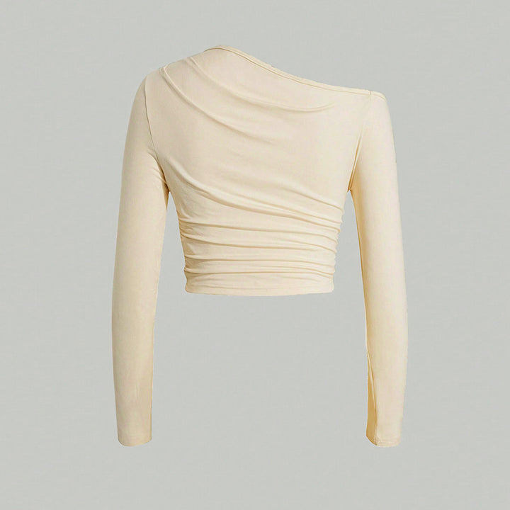 Kvinnors asymmetrisk långärmad crop top med lätt rynkeffekt Mirla-Eva Jonsson