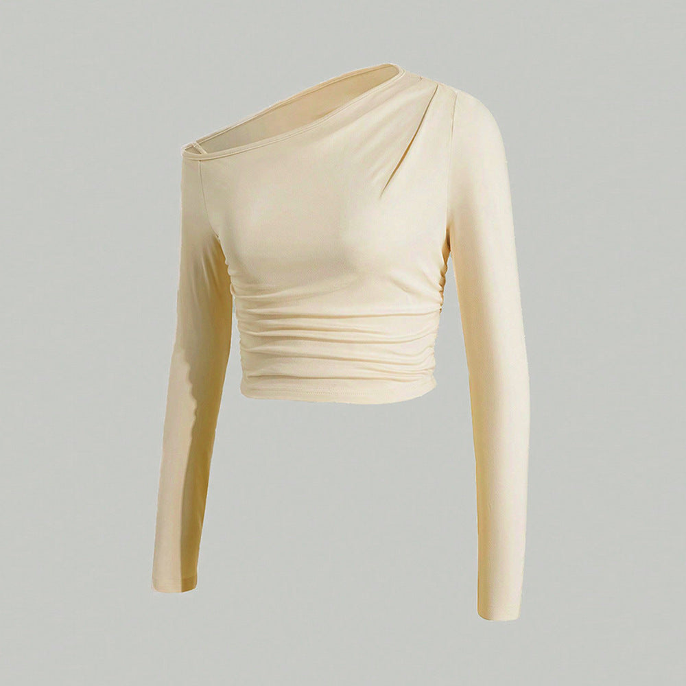 Kvinnors asymmetrisk långärmad crop top med lätt rynkeffekt Mirla-Eva Jonsson
