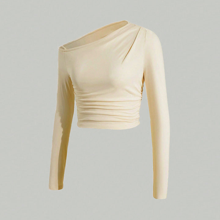 Kvinnors asymmetrisk långärmad crop top med lätt rynkeffekt Mirla-Eva Jonsson