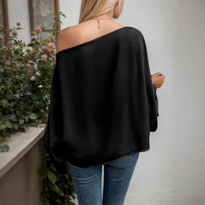 Kvinnors asymmetrisk långärmad topp med elegant drapering och fin V-hals Mirla-Eva Jonsson