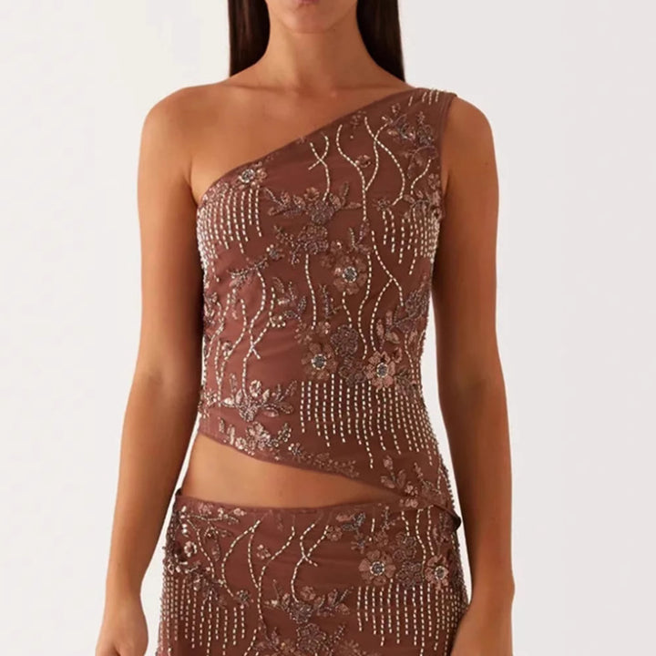 Kvinnors asymmetrisk topp med blommig rhinestone-design Mirla-Eva Jonsson