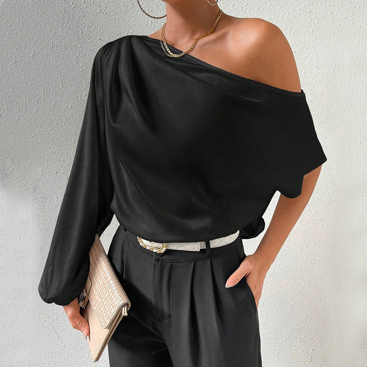 Kvinnors asymmetrisk topp med eleganta puffärmar Mirla-Eva Jonsson