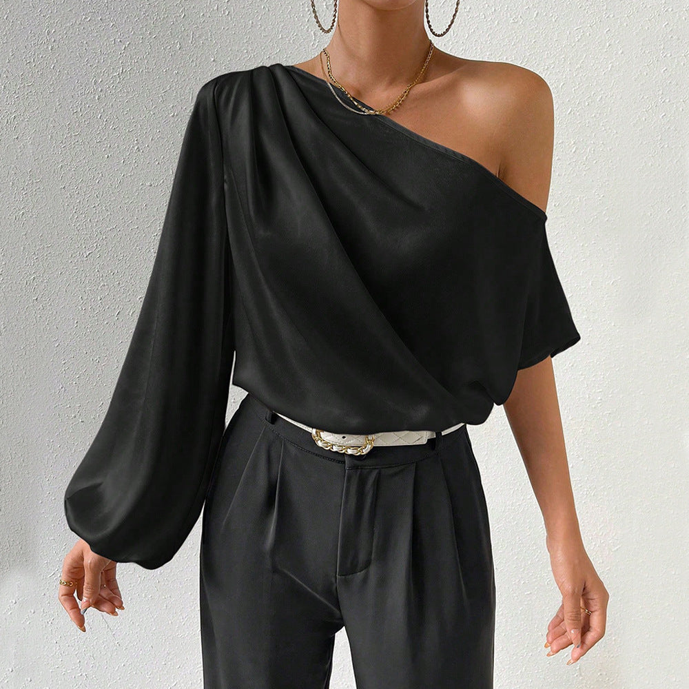 Kvinnors asymmetrisk topp med eleganta puffärmar Mirla-Eva Jonsson