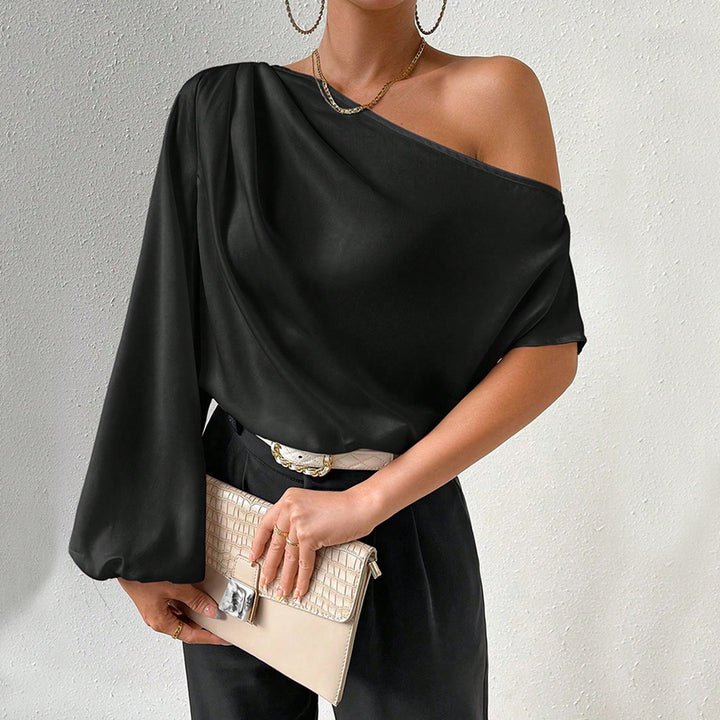 Kvinnors asymmetrisk topp med eleganta puffärmar Mirla-Eva Jonsson