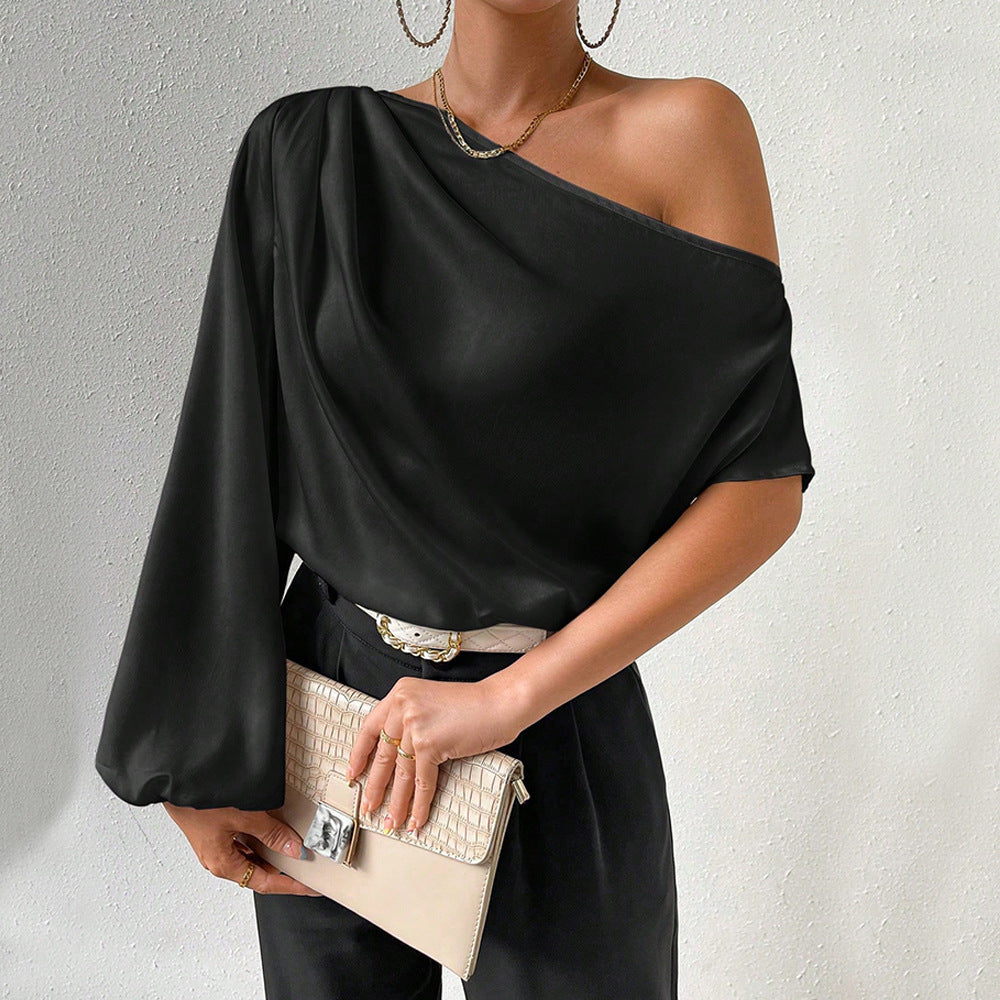 Kvinnors asymmetrisk topp med eleganta puffärmar Mirla-Eva Jonsson