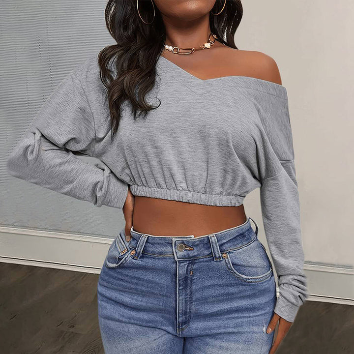 Kvinnors avslappnad crop top med off-shoulder design och åtsittande nederkant Mirla-Eva Jonsson