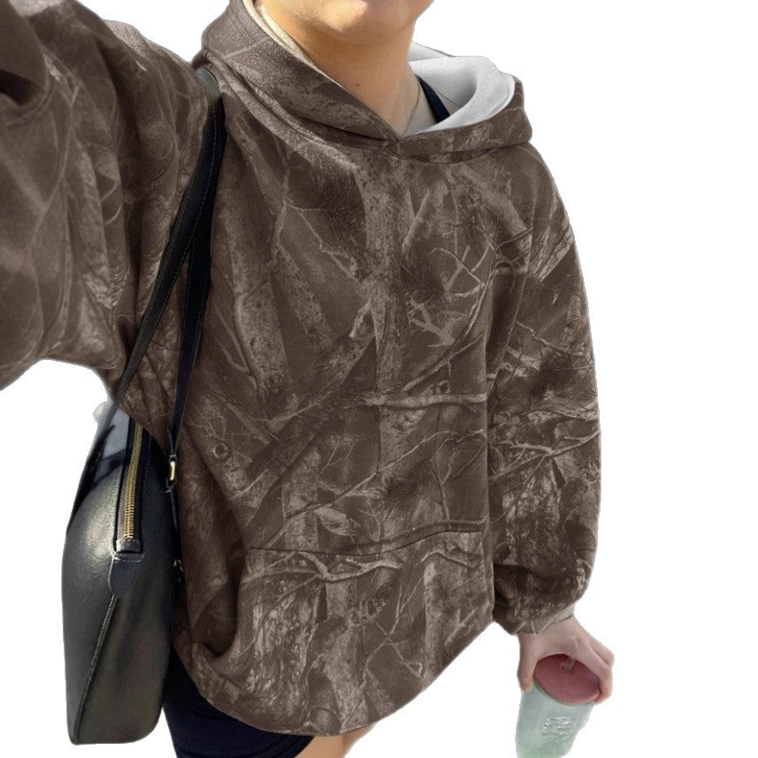 Kvinnors avslappnad hoodie med kamouflagemönster Mirla-Eva Jonsson