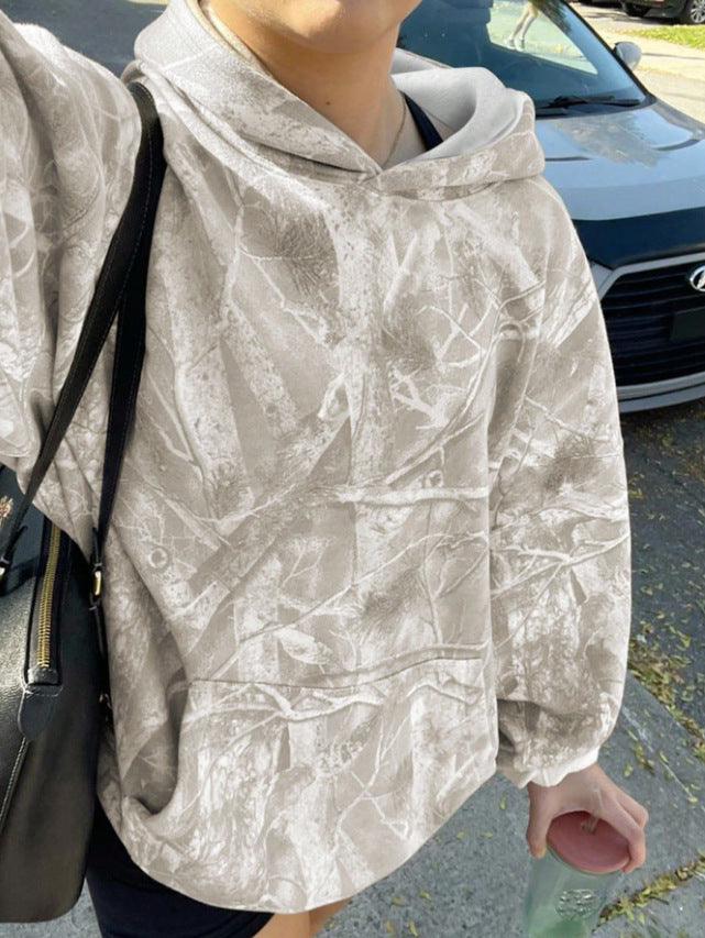 Kvinnors avslappnad hoodie med kamouflagemönster Mirla-Eva Jonsson
