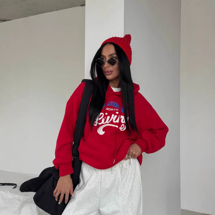 Kvinnors avslappnad hoodie med originaltryck och oversized skärning Mirla-Eva Jonsson