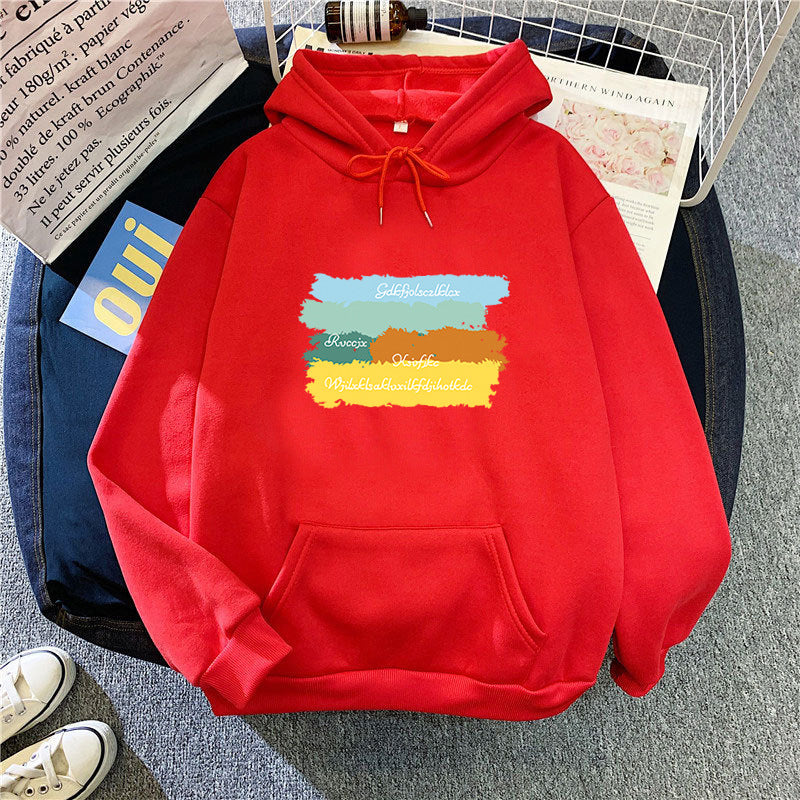 Kvinnors avslappnad huvtröja med kreativ grafisk design Mirla-Eva Jonsson