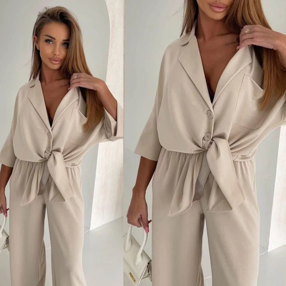 Kvinnors avslappnad jumpsuit med knytbälte och vida ben-Eva Jonsson