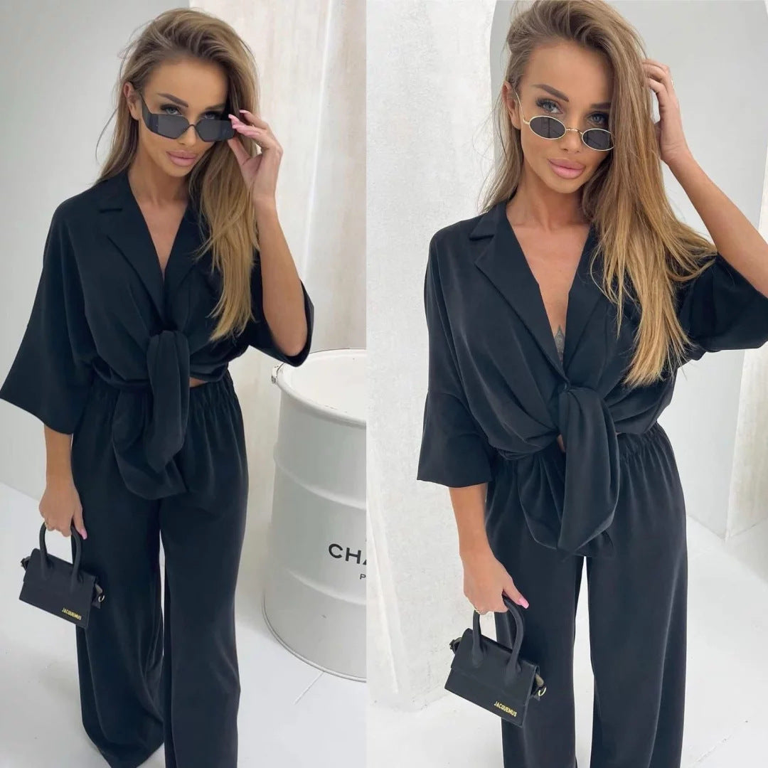 Kvinnors avslappnad jumpsuit med knytbälte och vida ben-Eva Jonsson